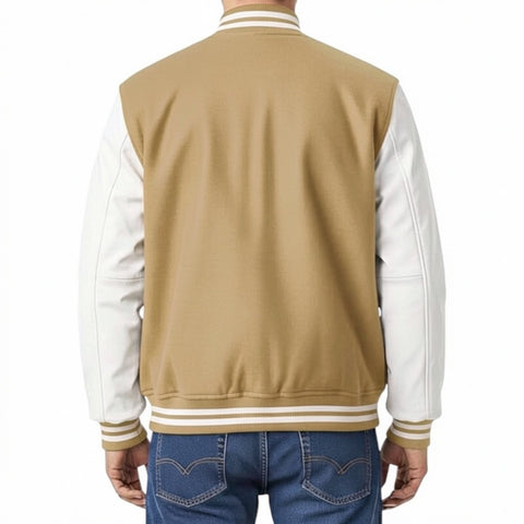 Camel and white varsity jacket worn by a person on a white background