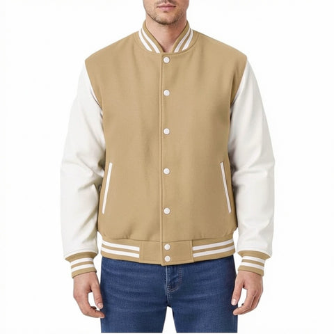 Camel and white varsity jacket worn by a person on a white background