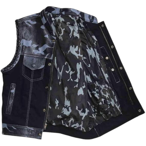 A sleeveless denim vest with a dark blue outer body, a black leather shoulder panel, and a black, gray, and white camouflage pattern lining.
