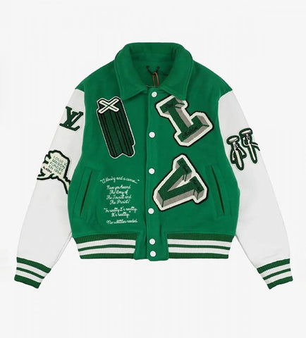 A green and white varsity-style jacket with embroidered letter patches, sleeve patches, and text details, shown flat on a light gray background.