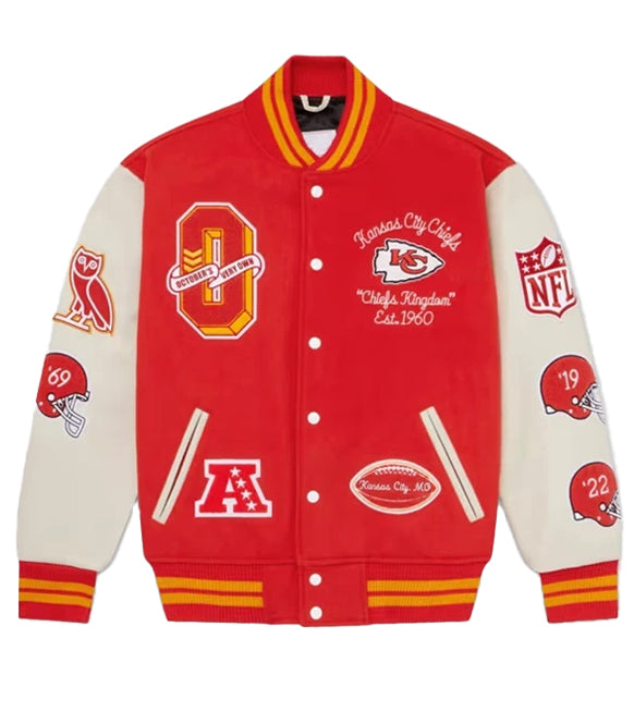 A red and cream varsity jacket featuring Kansas City Chiefs themed patches and logos, including a large 'O' on the chest, 'Chiefs Kingdom' text, and NFL shield patches on the sleeves.