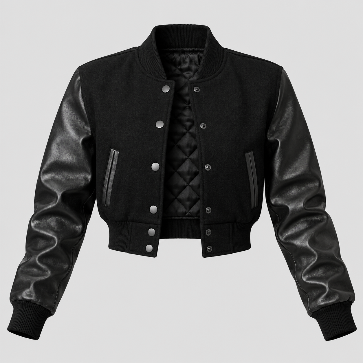 A black cropped bomber jacket with smooth faux-leather sleeves and a quilted inner lining, shown against a solid light gray background.