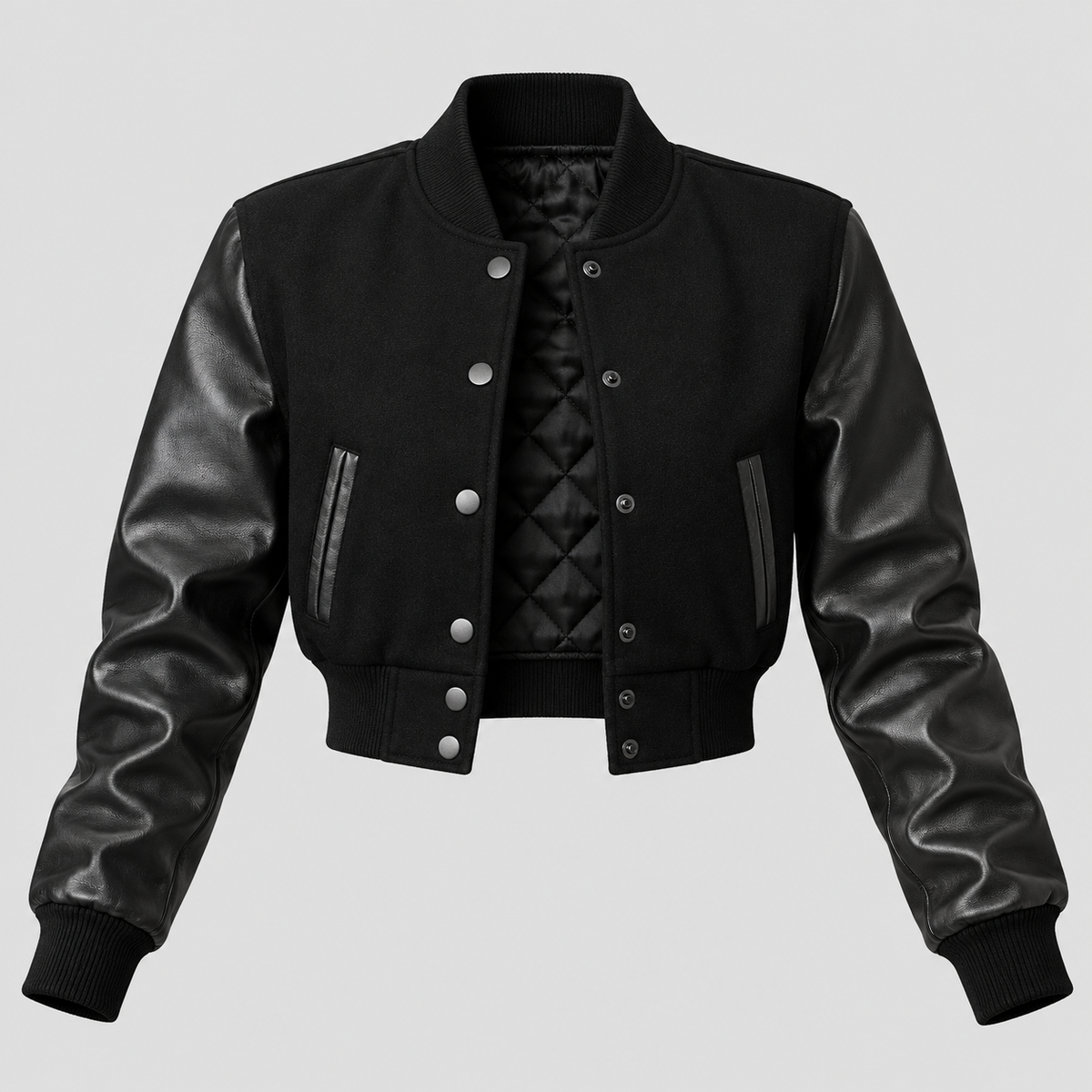 A black cropped bomber jacket with smooth faux-leather sleeves and a quilted inner lining, shown against a solid light gray background.