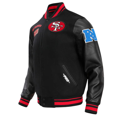 Black varsity jacket with red and blue accents on a white background