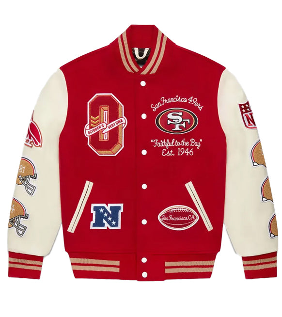 A red and cream varsity-style jacket with San Francisco 49ers patches, featuring a red front panel, cream sleeves, and multiple embroidered team logos and text.