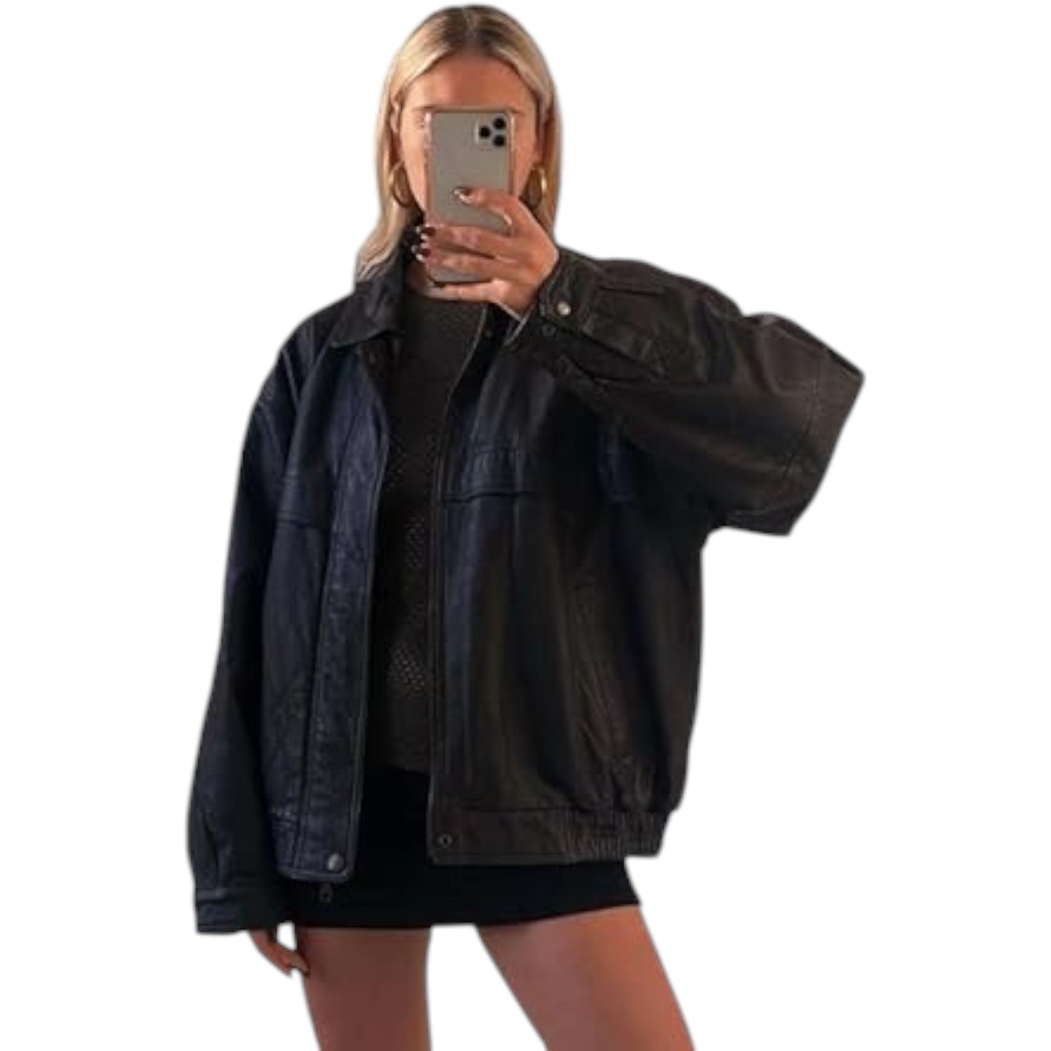 Person wearing a dark denim jacket taking a mirror selfie on a white background