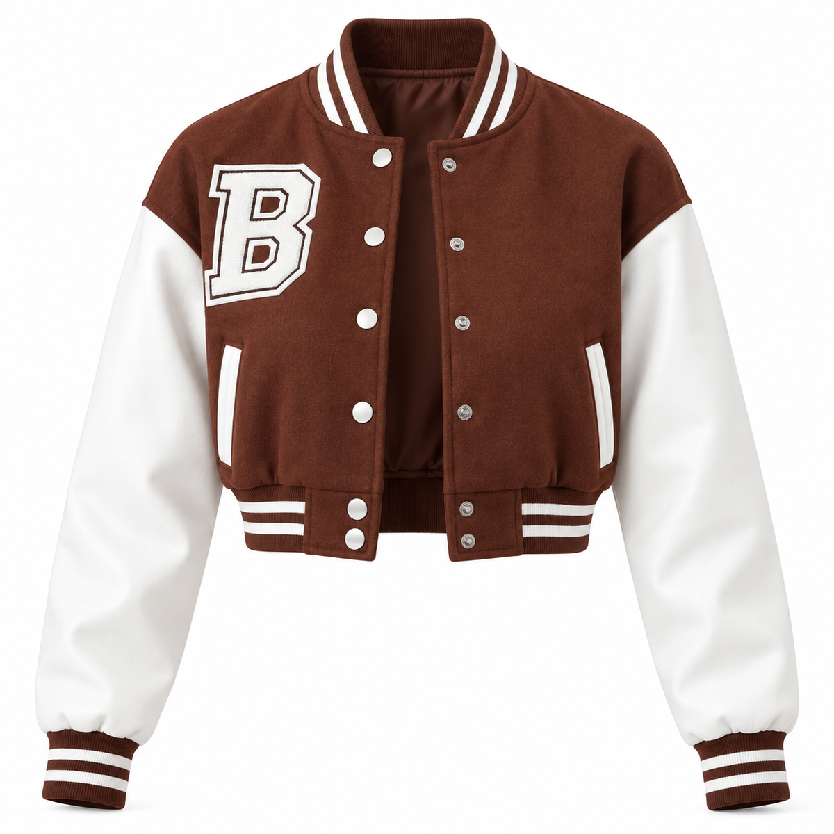 A cropped varsity jacket with a brown body and white sleeves, featuring a large white block letter 'B' outlined in black on the left chest, silver snap buttons, and striped ribbed trim.