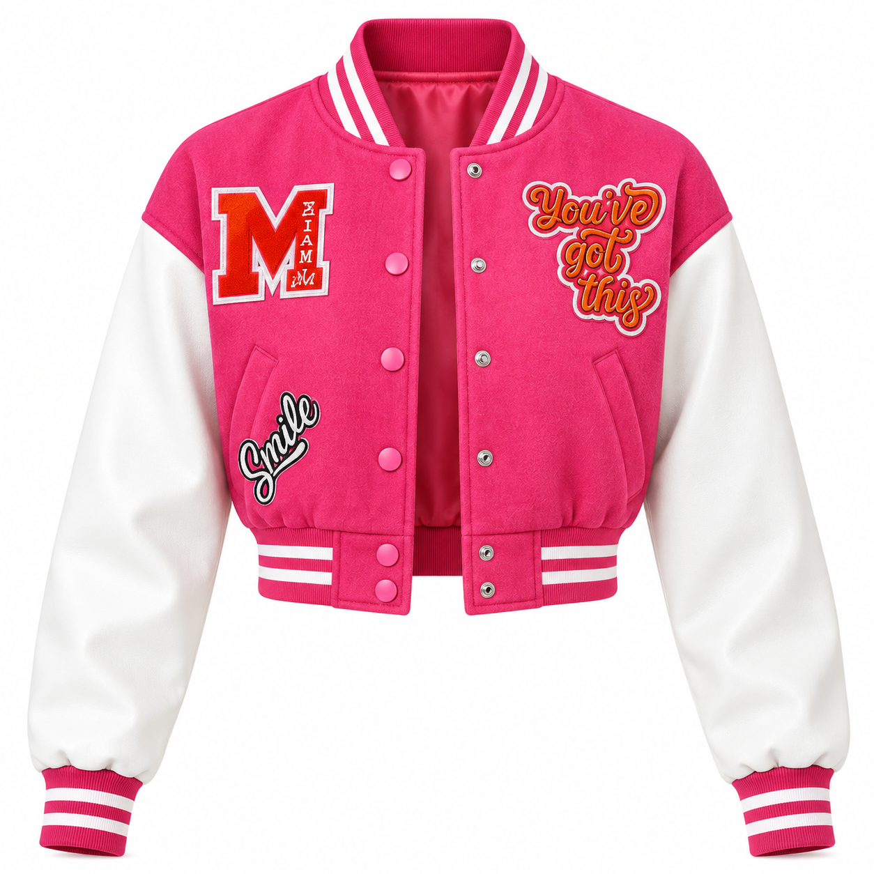 A pink and white varsity jacket with a bright pink body, white sleeves, and various embroidered details including a large 'M' on the left chest, 'You'll get this' on the right chest, and 'Smile' on the left sleeve.